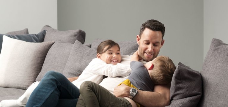 dad and kids on sofa